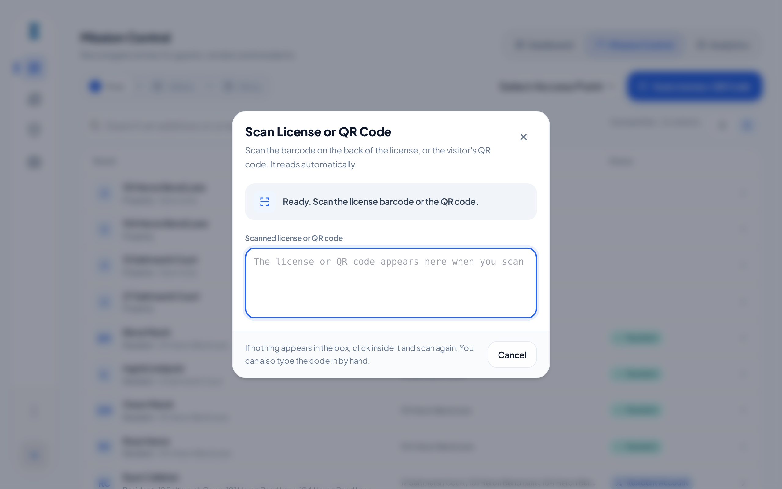 The Scan License or QR Code dialog, ready for a scan, with an empty Scanned license or QR code box and the Cancel button