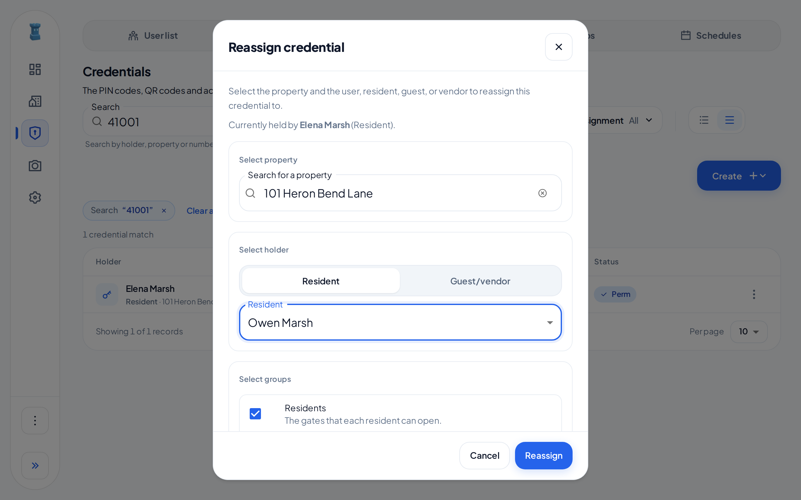 The Reassign credential dialog, with the current holder, the Select property and Select holder sections, a new resident and the Residents group selected