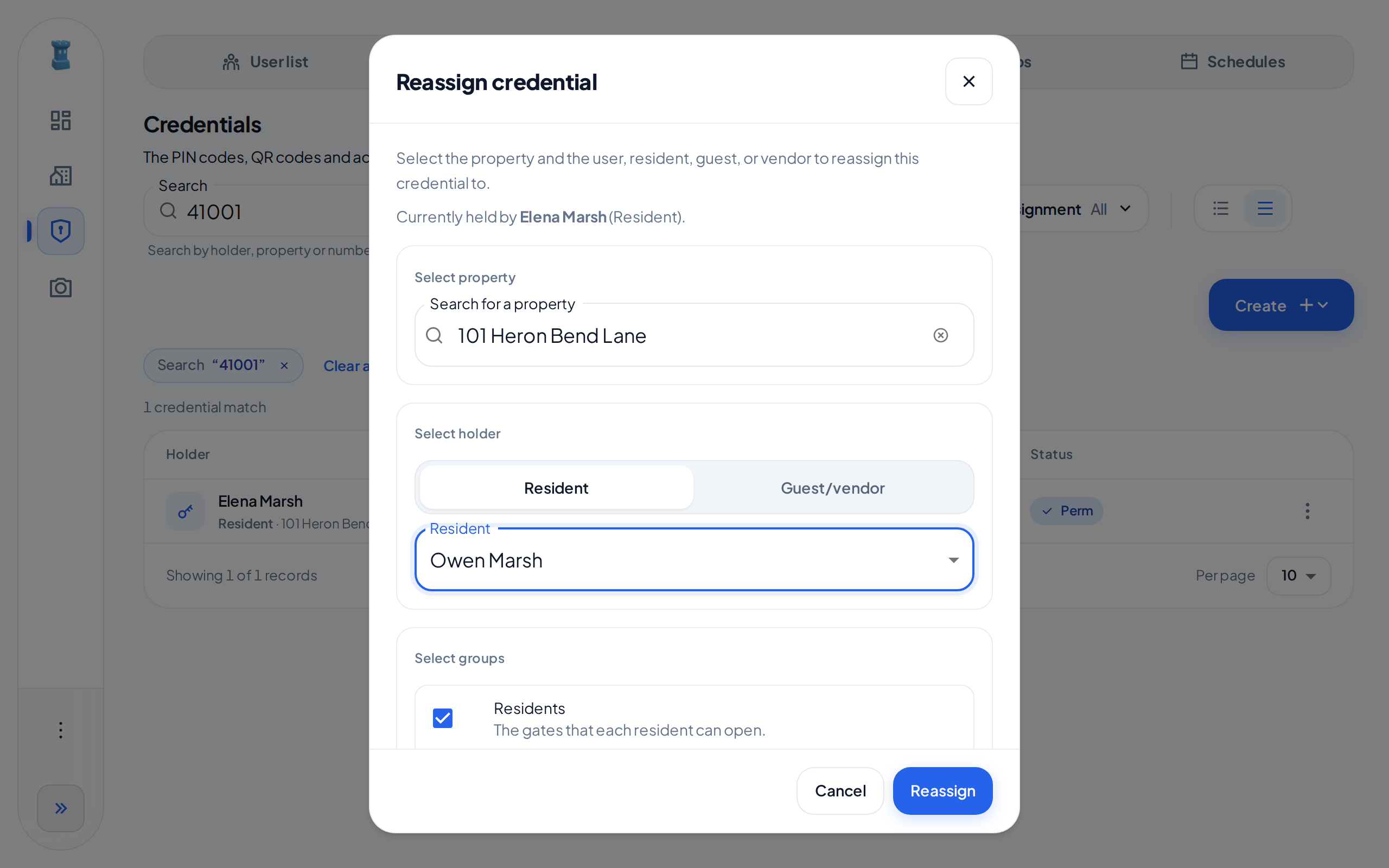 The Reassign credential dialog, with the current holder, the Select property and Select holder sections, a new resident and the Residents group selected