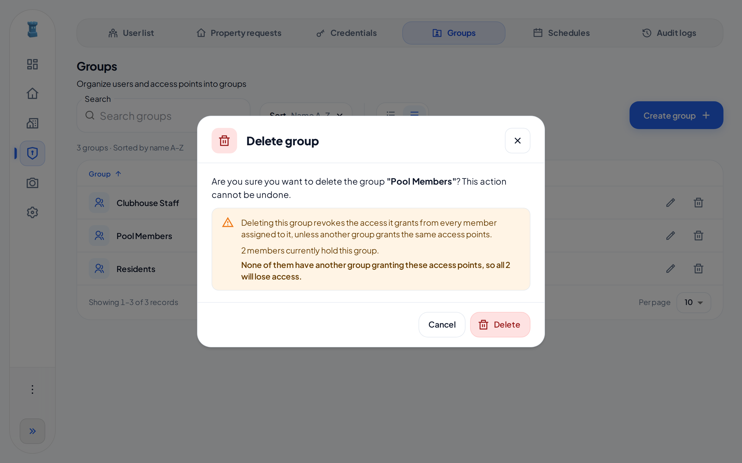 The Delete group dialog for Pool Members. It says that 2 members hold the group and that both will lose access.